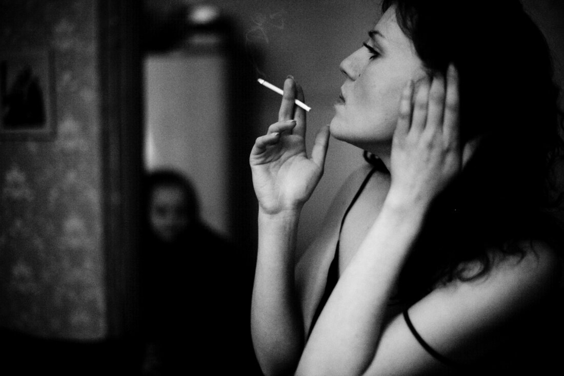 black and white photo young woman smoking